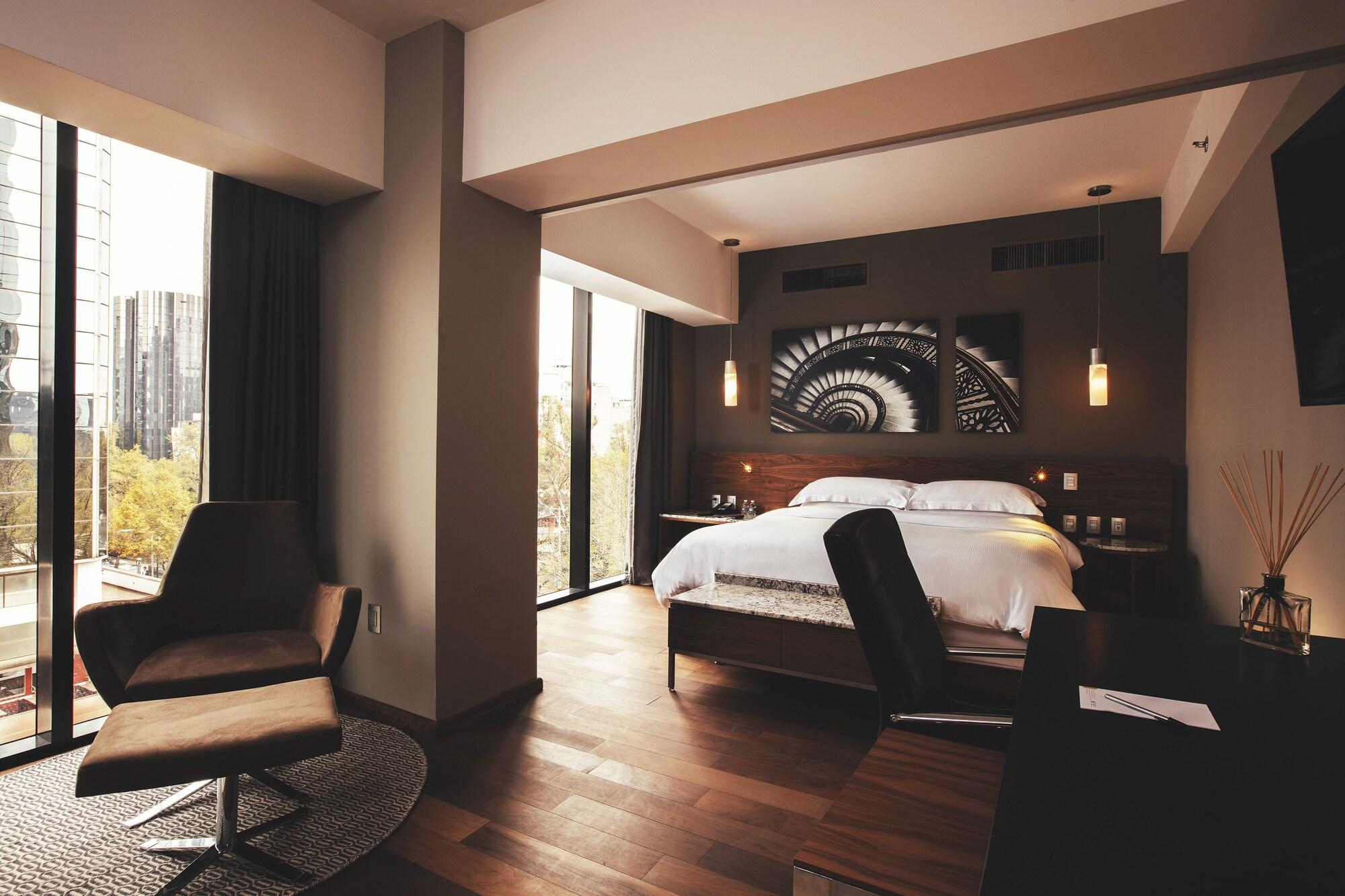 Krystal Grand Suites Insurgentes Ciudad de México Exterior foto A bedroom at the hotel